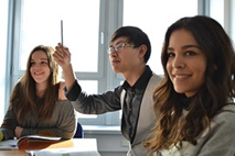 3 students smiling